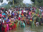 Bengaluru: Devotees perform rituals during 'Chhath Puja' festivities, at a makes...