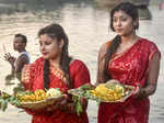 Balurghat: Devotees perform rituals of Chhath Puja festival, at the bank of the ...