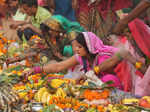 New Delhi: Devotees perform rituals during Chhath Puja festivities, at a tempora...