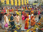 New Delhi: Devotees perform rituals during Chhath Puja festivities, at a tempora...