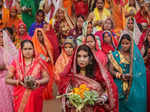 New Delhi: Devotees perform rituals during Chhath Puja festivities, at a tempora...