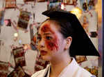 A woman wearing a Halloween costume poses for photographs on the street in downtown Seoul