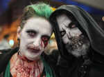 People dressed up in scary costumes to participate in the annual Zombie Walk and...