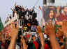Imran Khan leads a march to pressure the government to announce new elections, in Lahore