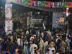 People gather near a truck after a shooting incident on a long march by former Pakistan Prime Minister Imran Khan, in Wazirabad