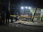 Members of the police inspect the crime scene after the shooting incident on long march by former Prime Minister Imran Khan, in Wazirabad