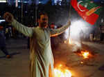 Supporters of Pakistan former Prime Minister Imran Khan, protest following the shooting incident on his long march in Wazirabad, in Karachi,