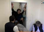 Former Pakistani Prime Minister Khan is helped after he was shot in the shin in Wazirabad