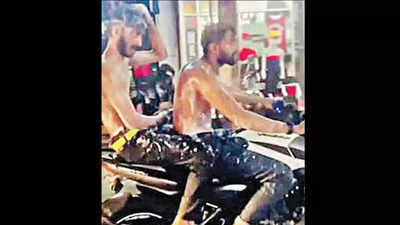 Kerala: Youths in Kollam take bath on moving bike, fined