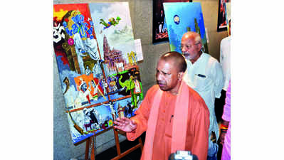 CM Yogi inaugurates exhibition of paintings on PM Modi’s achievements, work