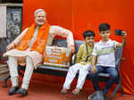 Ahmedabad: Boys take a selfie with a statue of Prime Minister Narendra Modi, ins...