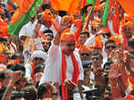 Surat, Nov 14 (ANI): BJP candidate Harsh Sanghvi with party supporters going to ...