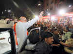 Ahmedabad: Union Home Minister Amit Shah waves at supporters upon his arrival to...