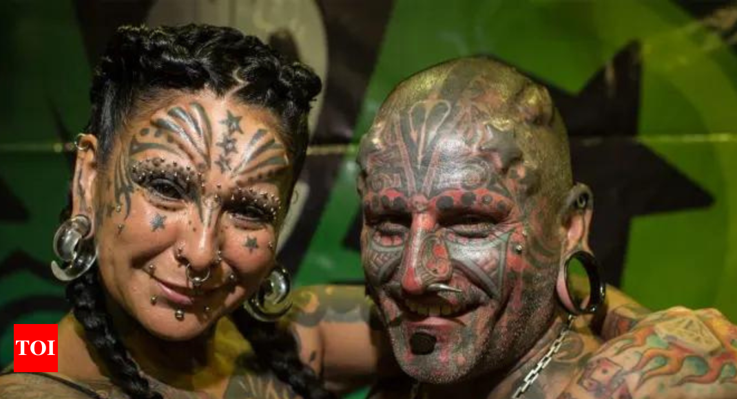 A couple from Argentina sets a world record with 98 tattoos 14 implants  and more  Times of India