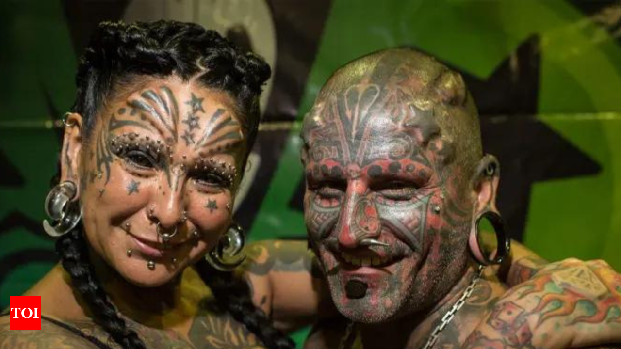 A couple from Argentina sets a world record with 98 tattoos, 14 implants  and more - Times of India