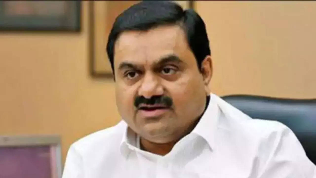 gautam adani, asia's richest man, makes a $5 billion bet to silence debt-obsessed critics | india business news - times of india