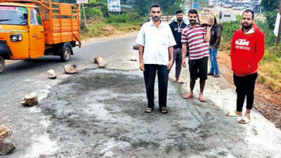 Karnataka: Activists fill potholes on arterial road in Kodagu