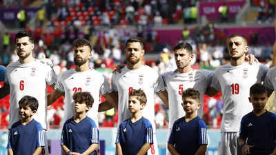 Iran players sing national anthem against Wales at World Cup match