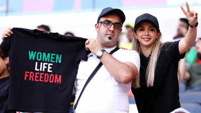 Security escort man wearing pro-Iran protest shirt ahead of match