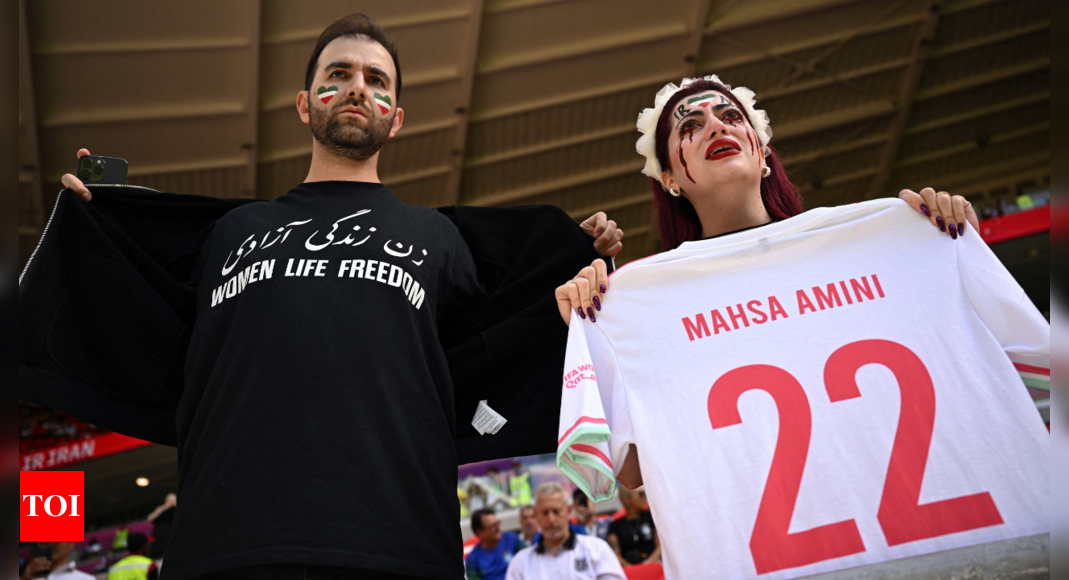 Iran regime supporters confront protesters at World Cup game – Times of India