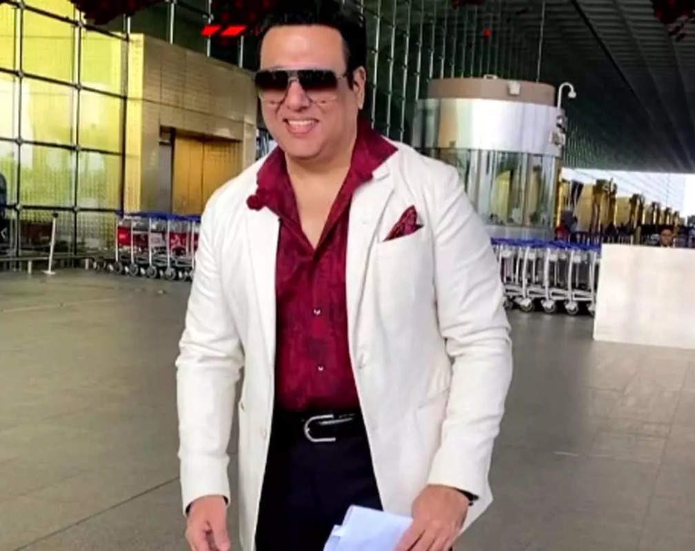 
Govinda amps up his style at Mumbai airport in a maroon shirt and black pants
