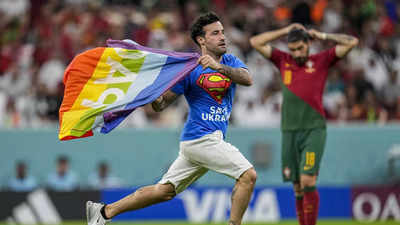 Watch: Man with rainbow flag invades pitch during FIFA World Cup match