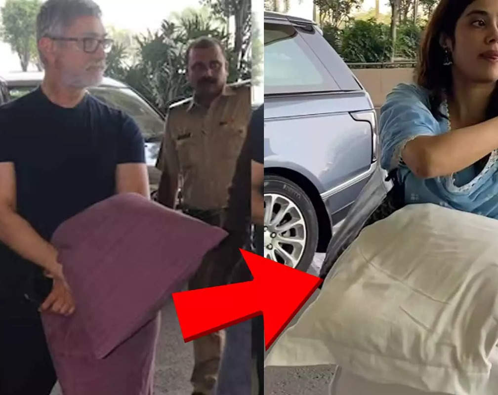 
After Aamir Khan, Janhvi Kapoor gets clicked carrying a pillow at airport, netizens say 'Naya fashion aya he..takiya leke jane ka'

