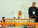 Gandhinagar, Dec 12 (ANI): Gujarat Chief Minister Bhupendra Patel signs a book a...