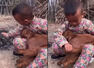 Viral video of a child keeping a baby goat warm