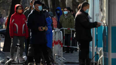 ‘Worked to the bone’: Chinese crematoriums battle Covid wave