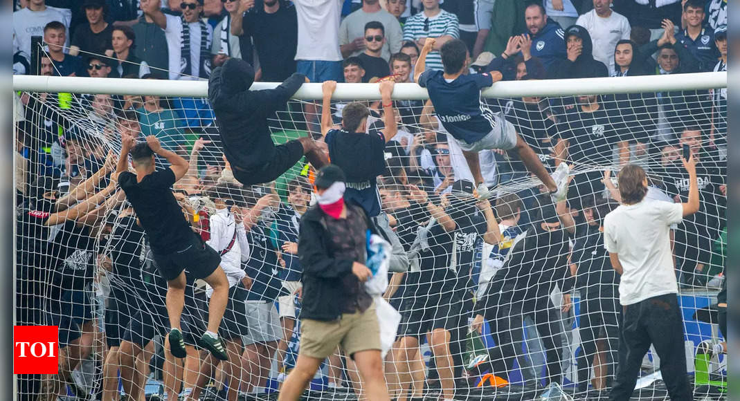 Goalkeeper injured as fans invade pitch in Melbourne derby | Football News – Times of India