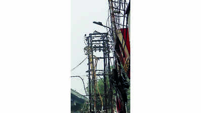Depts told to clearmaze of phone, TVcables in two mths
