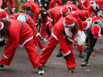 Santa run as cold weather continues, in Battersea Park, London