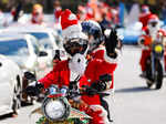 People dressed in Santa Claus costumes ride their motorbikes during Xmas Toy Run parade in Tokyo