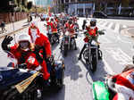 People dressed in Santa Claus costumes ride their motorbikes during Xmas Toy Run parade in Tokyo