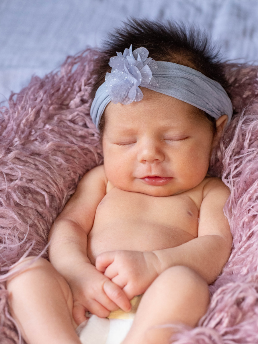 a-beautiful-baby-girl-wearing-a-red-dress-and-a-headband-twin-baby