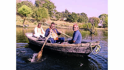 Poonia rows boat, meets inhabitants of remote island in Udaipur dist