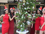 Bhopal:Girls dressed as Santa Claus poses for photos during a Christmas carnival in Kolkata on Friday December 23,2022.(PHOTO:IANS/Hukum Verma)