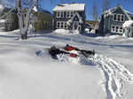 This photo provided by Clare Purcell shows two people making snow angels after a...
