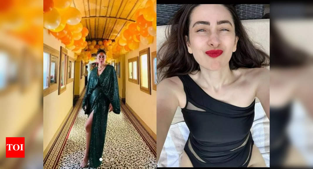 Kareena Kapoor Khan celebrates New Year in an emerald green gown, while Karisma Kapoor stuns in a black monokini, but Taimur steals the show! – Times of India