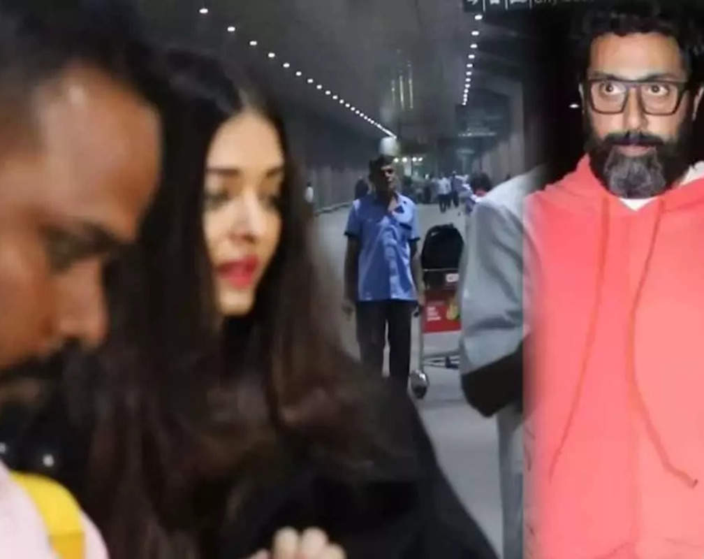 
Abhishek Bachchan safely escorts his wife Aishwarya Rai Bachchan to the car as fans try to click her pictures
