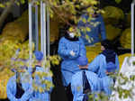 Staff members speak next to several body bags at a funeral home, as coronavirus disease (COVID-19) outbreaks continue in Shanghai