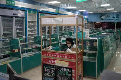 Travel curbs rack up as Covid-hit China readies reopening