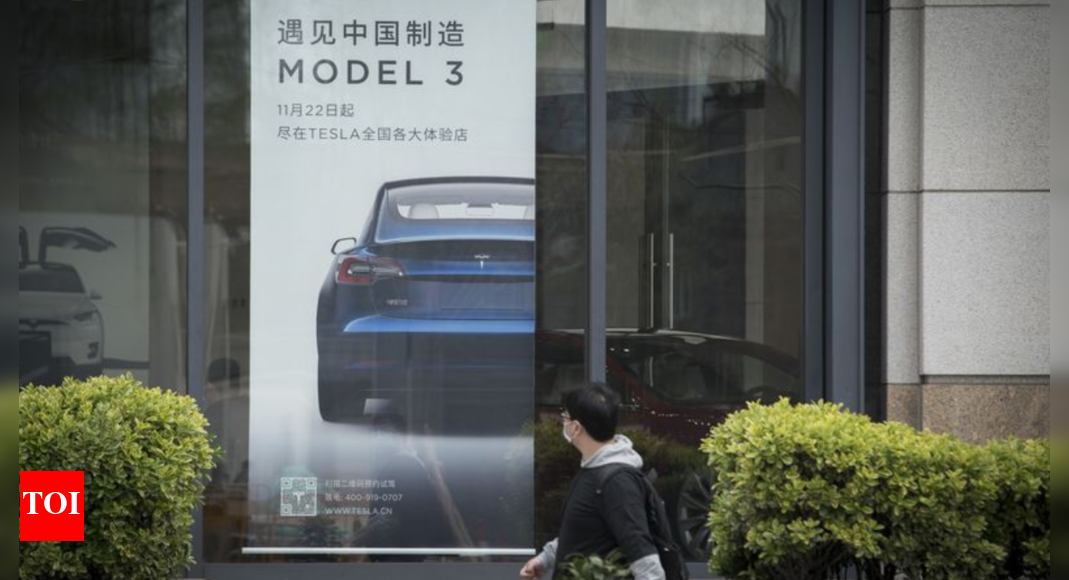 Tesla owners in China protest against surprise price cuts they missed ...