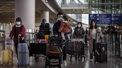 China’s open borders mark Covid Zero end, spark rush home - Times of India