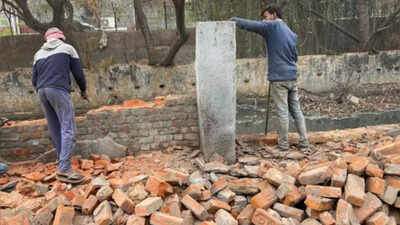 Work to cover Arun Vihar stormwater drain begins after decade-long wait, residents hold puja