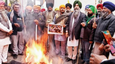 Bonfire from wood of razed houses in Jalandhar