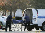 The body of Huu Can Tran is retrieved from a van by the Los Angeles County coron...