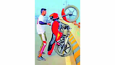 Stunt biker, road dancer face police music