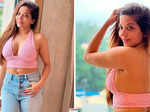 Monalisa sets hearts racing in pink crop top and blue denim jeans